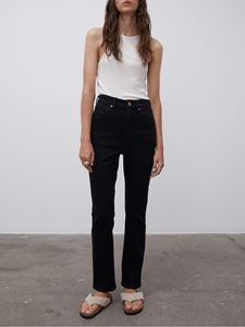Front shot of model wearing black Stellen Jeans - by Malene Birger and white top