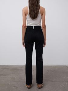 Back shot of model wearing black Stellen Jeans - by Malene Birger and white top