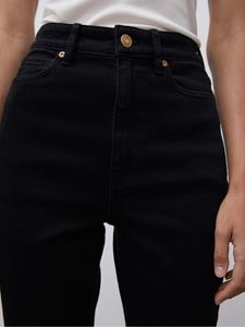Close shot of model wearing black Stellen Jeans - by Malene Birger and white top